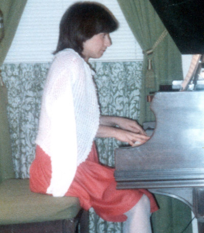 At the piano